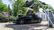 Konligo Fastival event structure with greenery and branding elements showcased at an outdoor car display, now available on MTN Shop US. - imagen 6