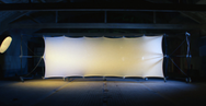 Konligo Luno Wall modular structure with stretched white illuminated fabric panel set up indoors for dramatic lighting effect, now available on MTN SHOP US. - imagen 6